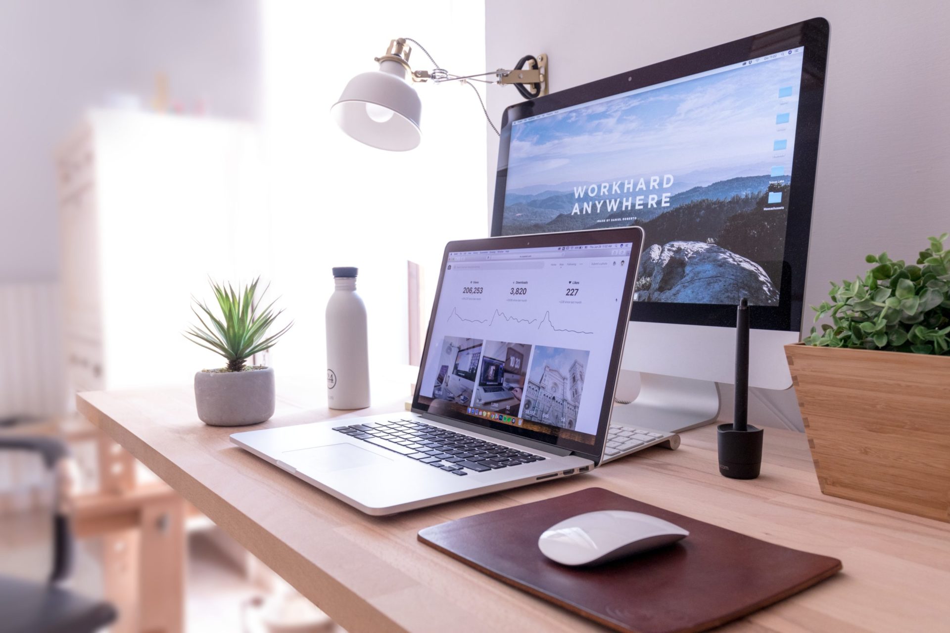double monitor computer on a wood desk
